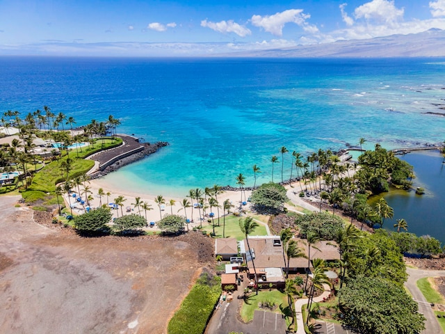 birds eye view of property with a water view and a view of the beach