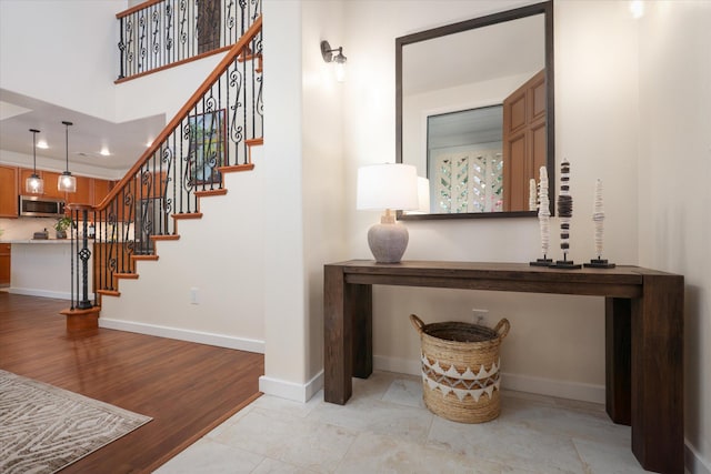 interior space featuring baseboards and wood finished floors