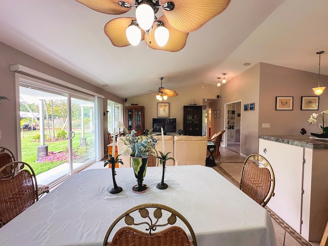 dining area featuring lofted ceiling and ceiling fan