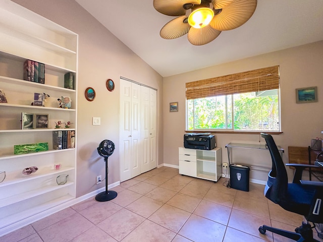 office space with lofted ceiling, light tile patterned floors, built in shelves, and baseboards