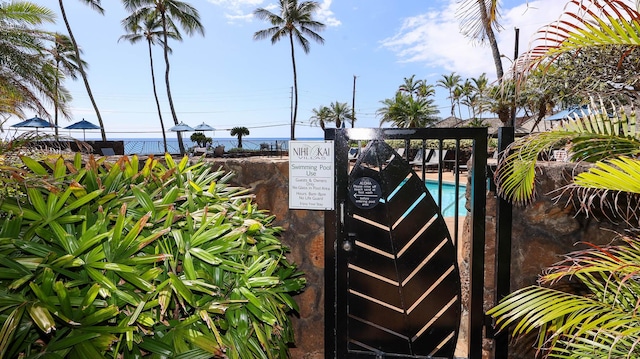 exterior details with fence and a pool