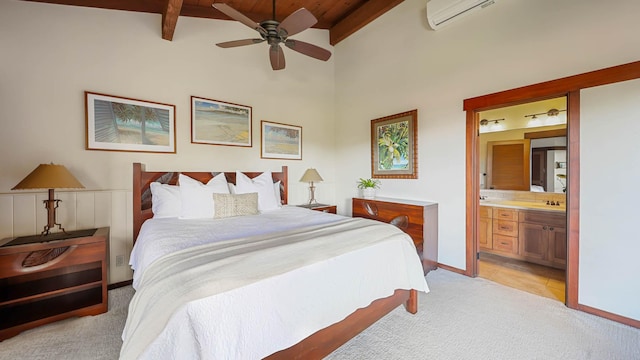 bedroom featuring beam ceiling, a wall unit AC, light colored carpet, connected bathroom, and a sink