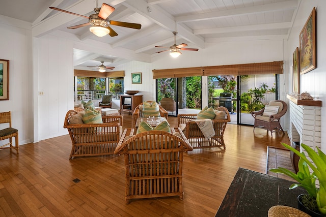 interior space featuring vaulted ceiling with beams and light wood finished floors