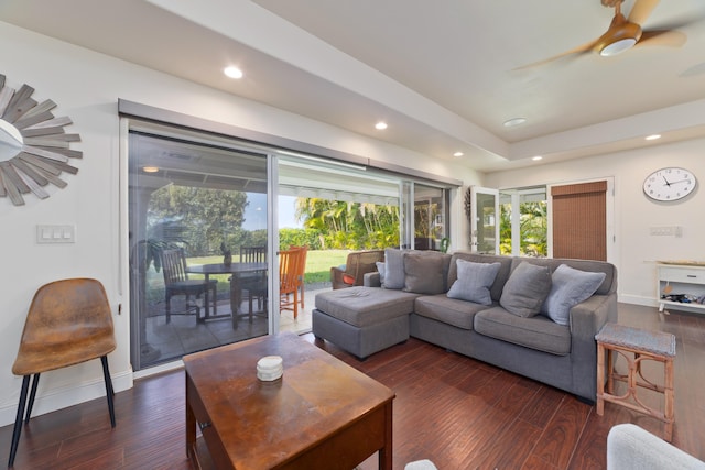 living room with baseboards, dark wood-style flooring, and recessed lighting