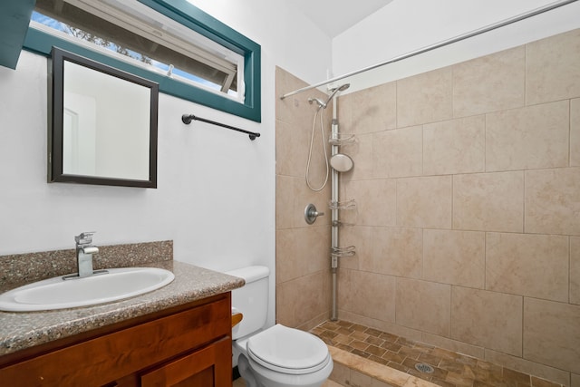 6450 Olohena Rd, Kapaa, HI 96746 - bathroom featuring tiled shower, toilet, and vanity