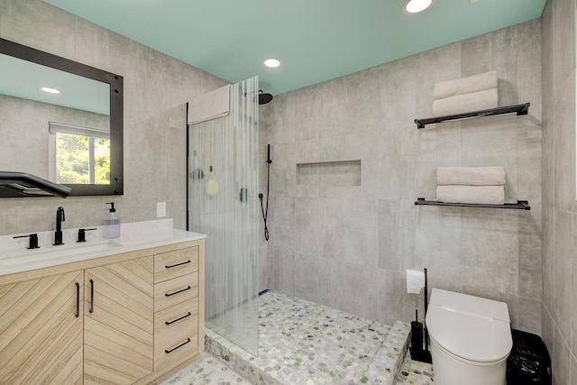 full bathroom featuring toilet, vanity, a walk in shower, tile walls, and recessed lighting