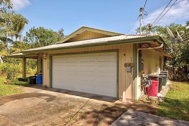 garage with concrete driveway