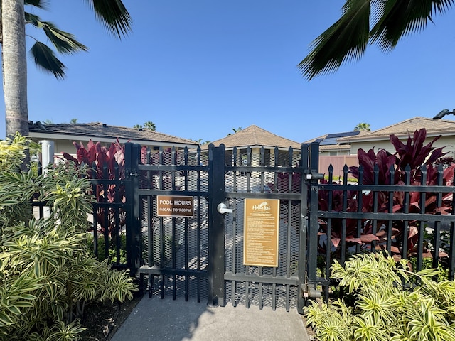 view of gate with fence