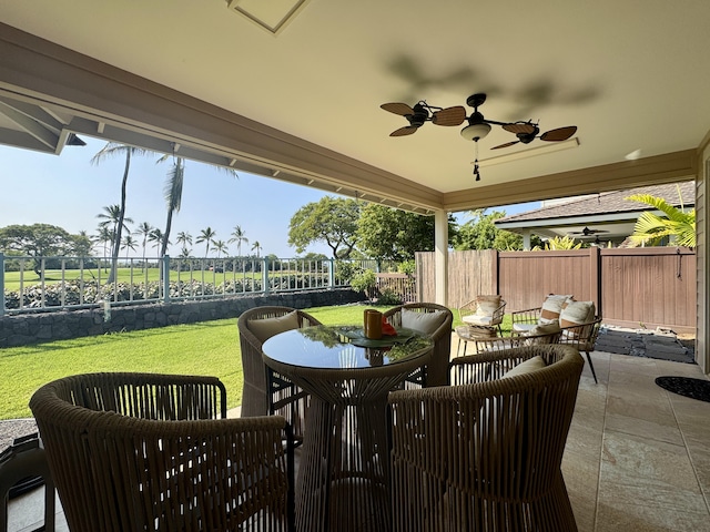 view of patio / terrace featuring a ceiling fan and fence