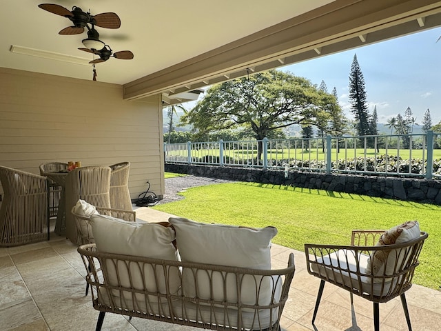 view of patio / terrace with outdoor lounge area, ceiling fan, and fence