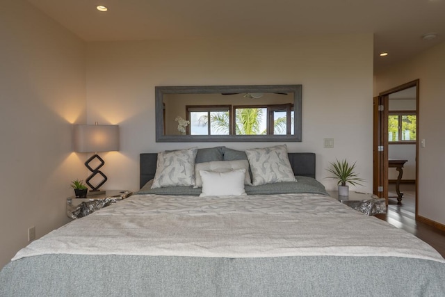 bedroom featuring recessed lighting and wood finished floors