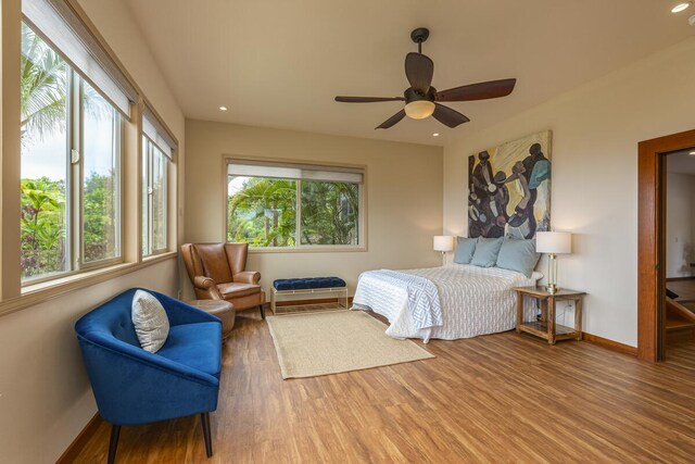 bedroom with recessed lighting, baseboards, and wood finished floors