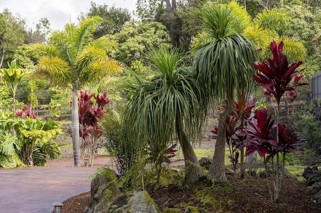 exterior space featuring driveway and fence