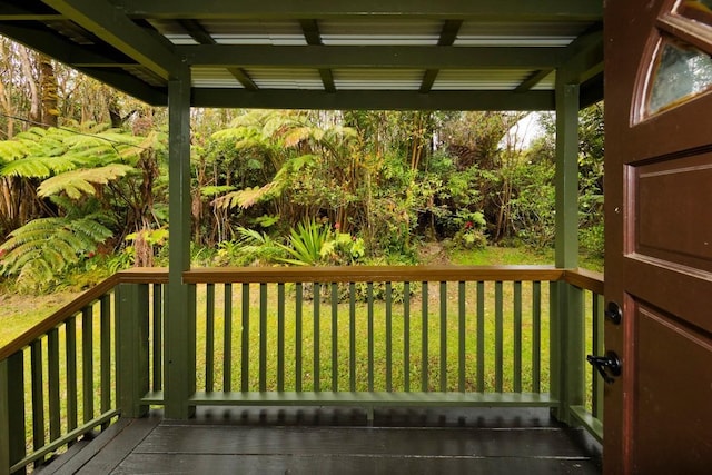 wooden deck with a yard