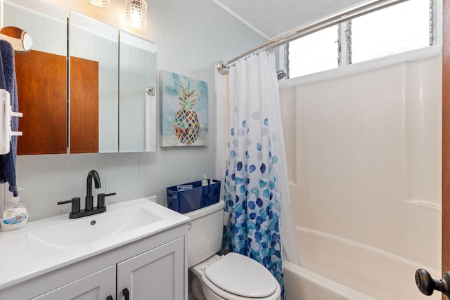 full bathroom with shower / bathtub combination with curtain, vanity, and toilet