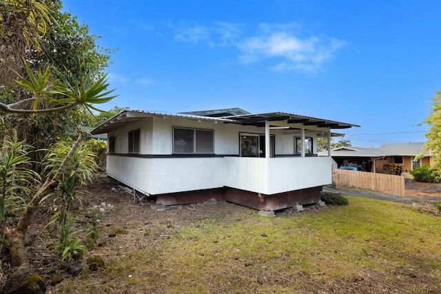 exterior space with a yard and fence