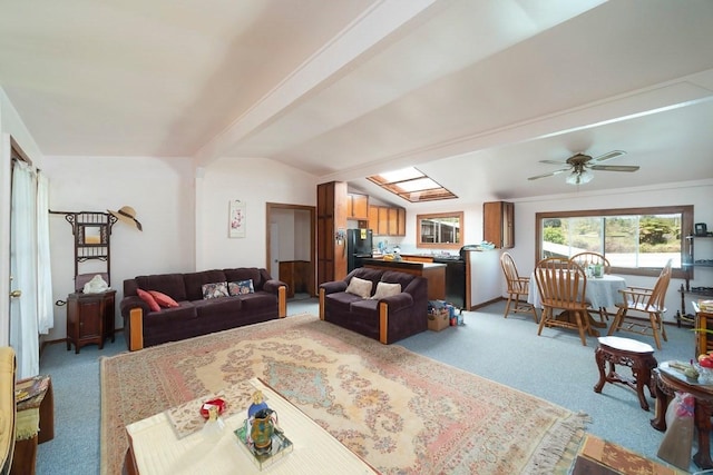 living room with light carpet, lofted ceiling, and a ceiling fan