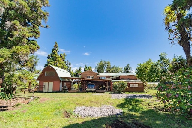 exterior space with a barn, a yard, and an outdoor structure