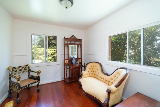 sitting room featuring dark wood finished floors and baseboards