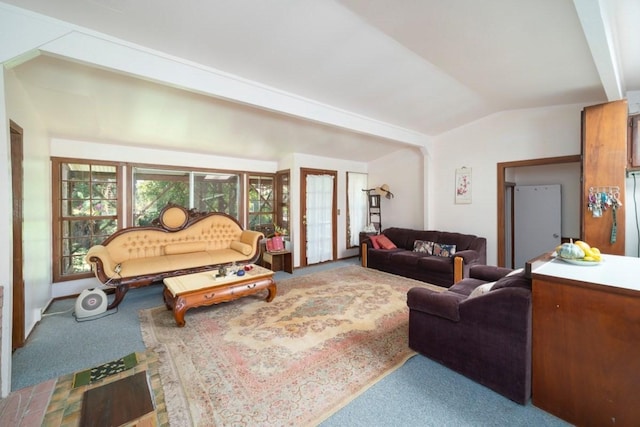 carpeted living room featuring vaulted ceiling