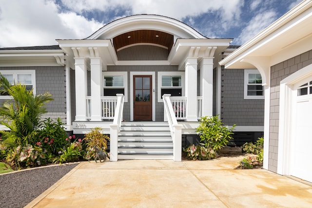 doorway to property featuring a porch