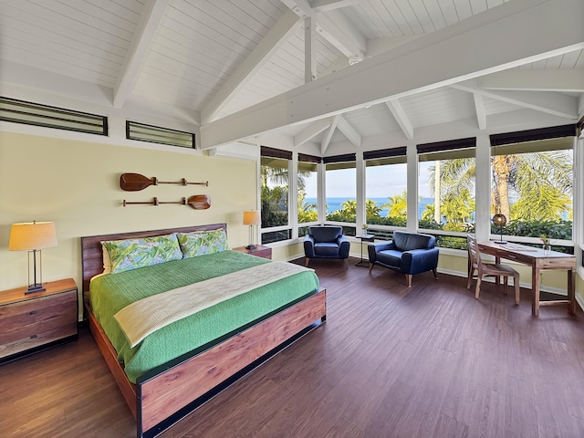 bedroom with lofted ceiling with beams and wood finished floors