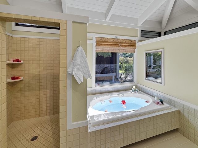 bathroom featuring a bath, tile patterned floors, tiled shower, and lofted ceiling with beams