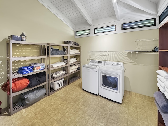 clothes washing area featuring tile patterned floors, laundry area, and separate washer and dryer