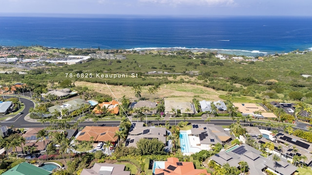 birds eye view of property with a water view and a residential view