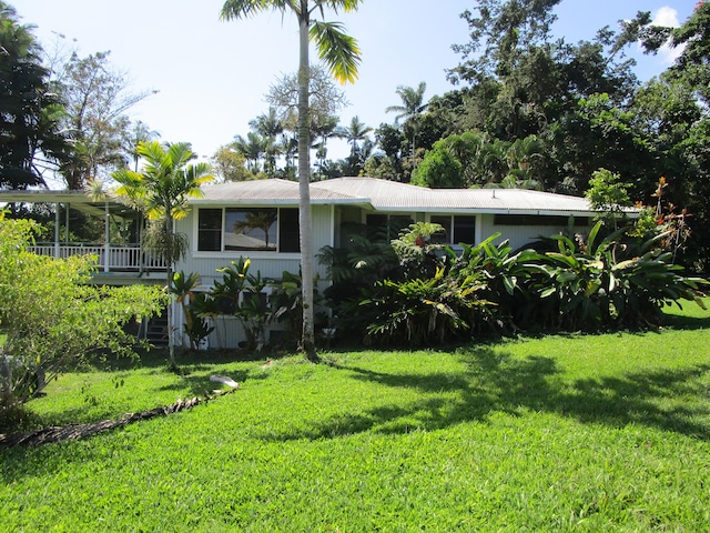 exterior space with a front lawn