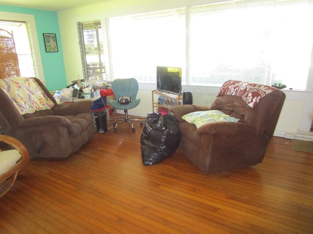 living area with a wealth of natural light and wood finished floors