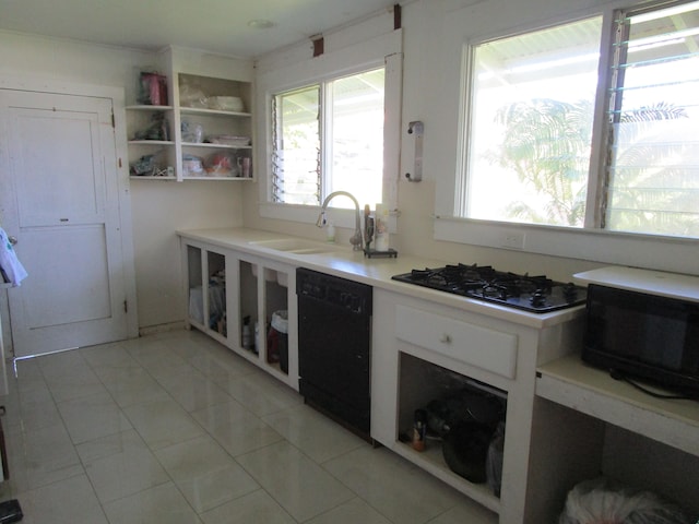 kitchen featuring open shelves, black appliances, light countertops, and a sink