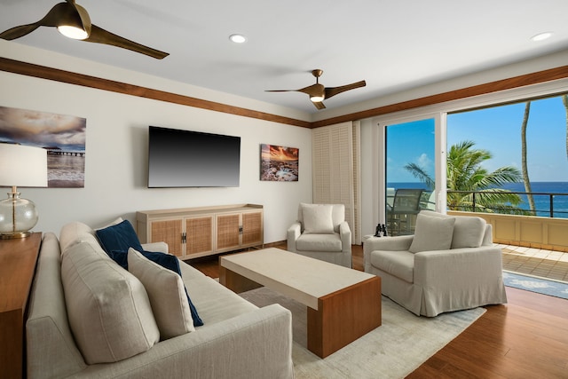 living room featuring recessed lighting, ceiling fan, and light wood-style flooring