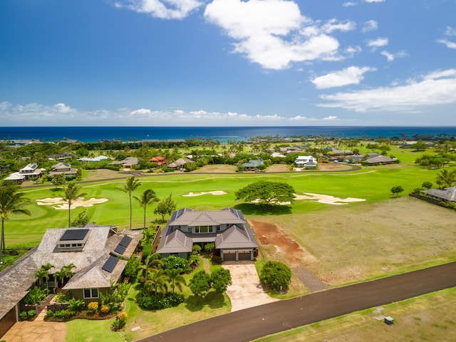 bird's eye view with view of golf course and a water view