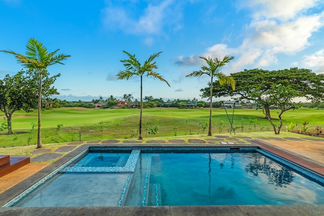 view of swimming pool with a pool with connected hot tub, a lawn, and golf course view