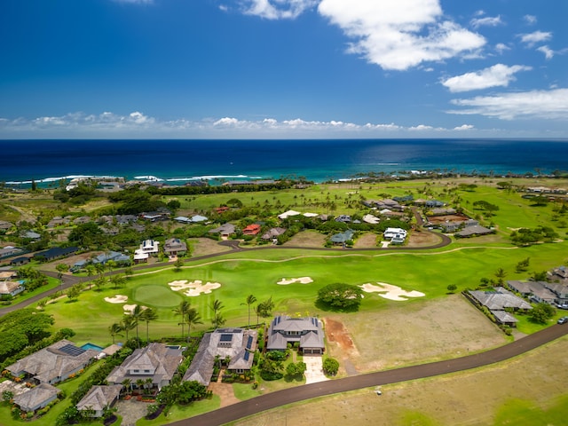 bird's eye view featuring golf course view and a water view