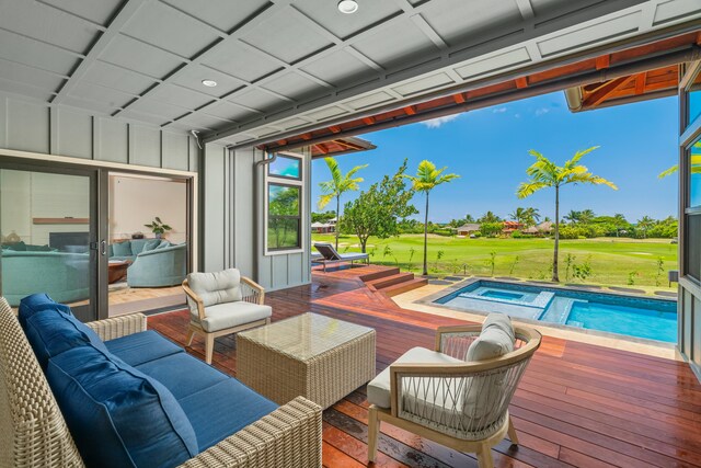 exterior space with an in ground hot tub, a lawn, and outdoor lounge area