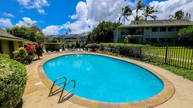 view of pool with a fenced in pool, a fenced backyard, and a patio