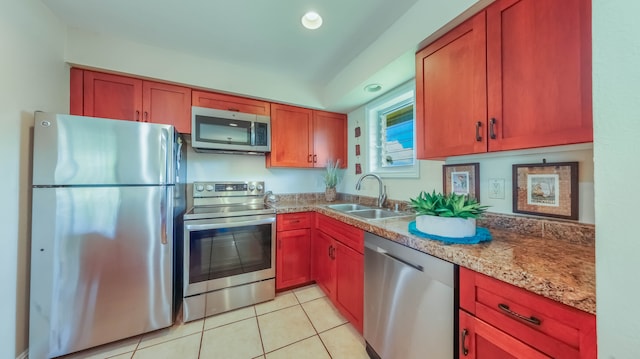 kitchen featuring stainless steel appliances, recessed lighting, a sink, and light tile patterned floors