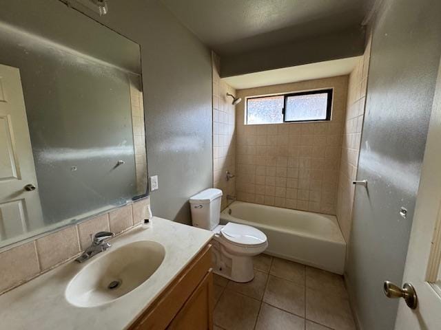 full bathroom featuring bathtub / shower combination, backsplash, toilet, vanity, and tile patterned flooring