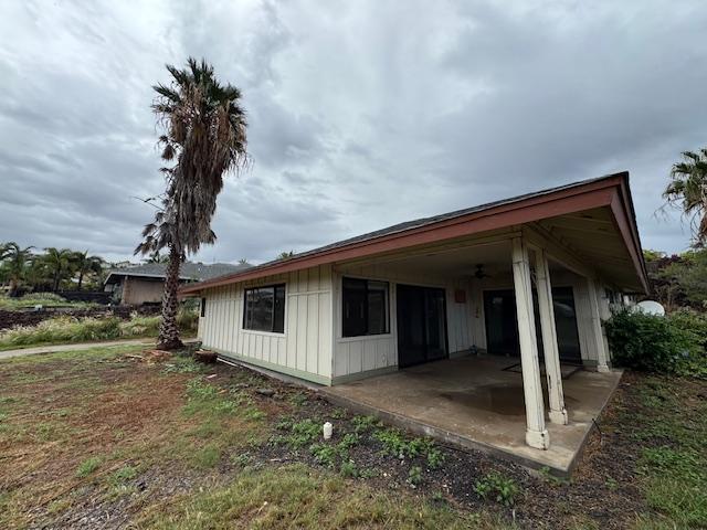 view of side of property featuring a patio area