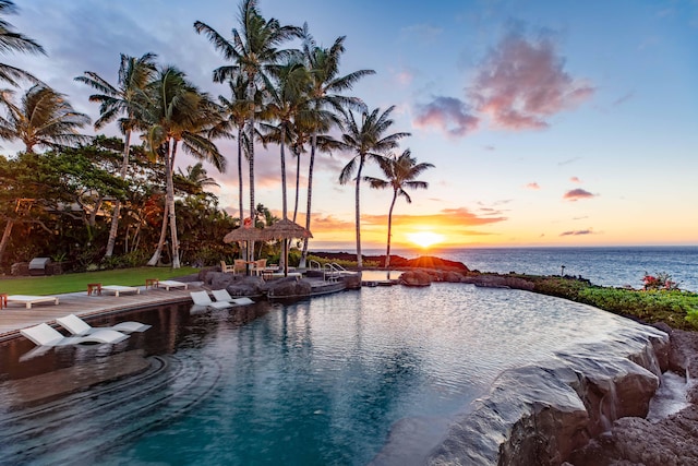 view of pool with a water view