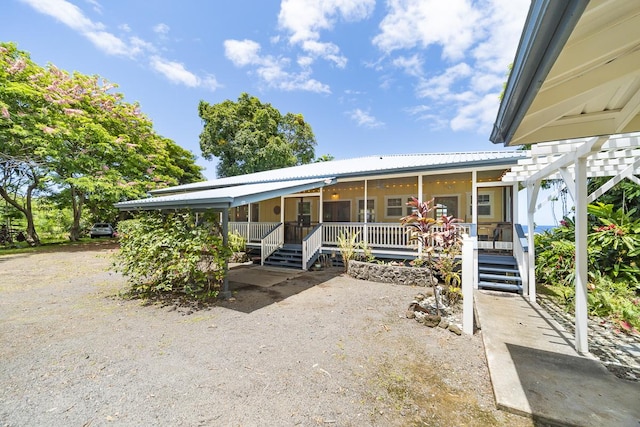 view of front of house featuring metal roof