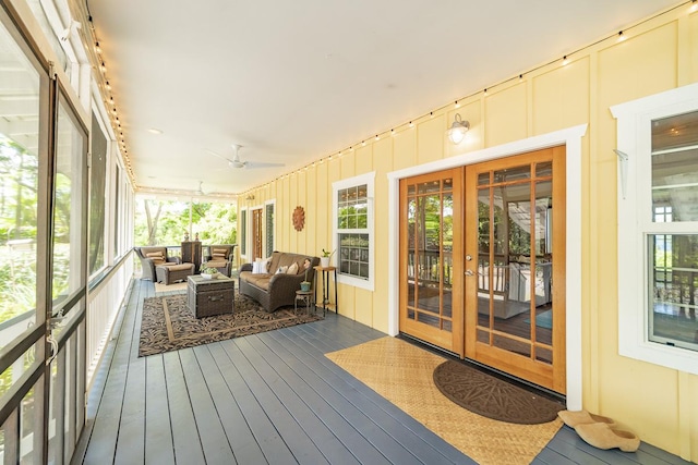 sunroom / solarium with ceiling fan