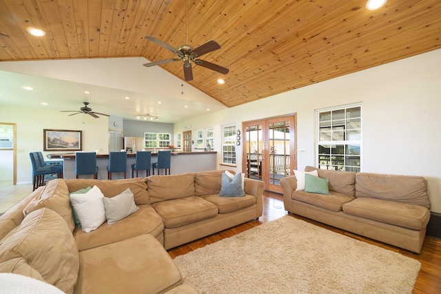 living area with high vaulted ceiling, recessed lighting, wood ceiling, and wood finished floors