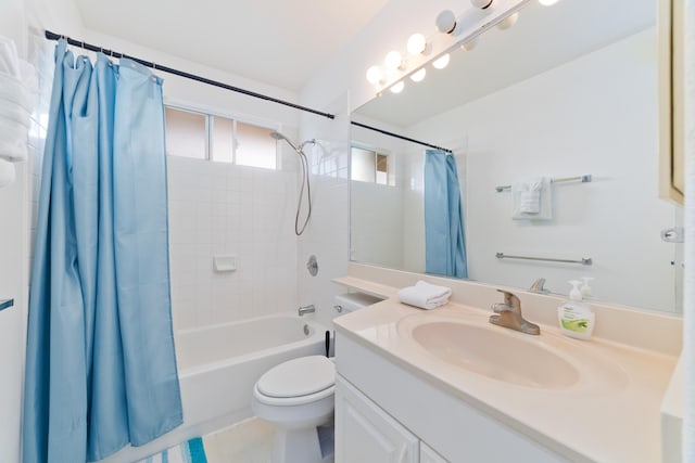 full bathroom featuring toilet, shower / bath combo, and vanity