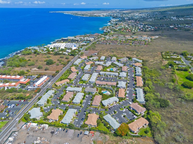 drone / aerial view featuring a water view and a residential view