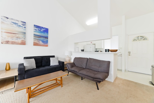 living area with high vaulted ceiling