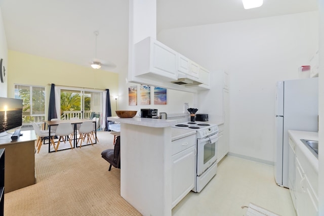 kitchen with high vaulted ceiling, white appliances, light countertops, and white cabinetry