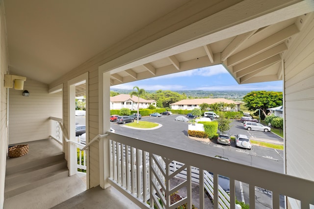 balcony featuring a residential view and covered porch